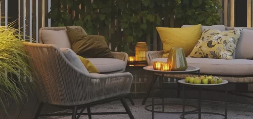 taras z meblami ogrodowymi oraz dywanem